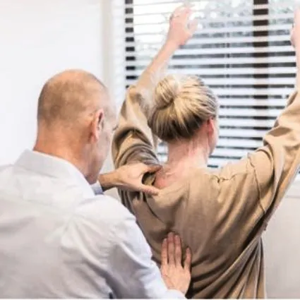 Dr Ash performing a mid-back adjustment