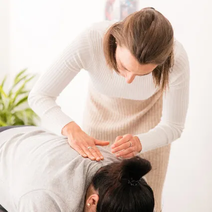 Dr Lydia applying gentle neck pressure