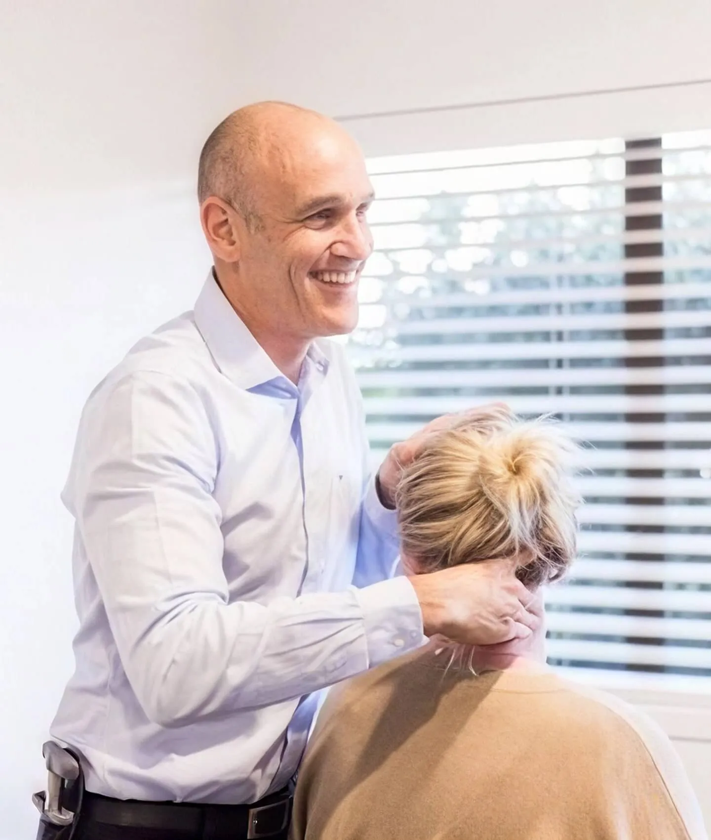 A member of the team with a patient in the practice